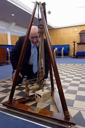 Steve Briggs with ancient stonemasonery equipment kept in the Lodge room at the west corner of the floor